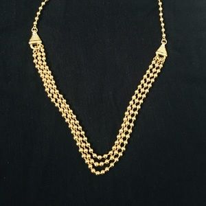Gold plated three strand beaded necklace.